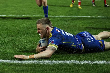 Photo for Matt Dufty of Warrington Wolves goes over for a try during the Betfred Super League Round 4 match Hull KR vs Warrington Wolves at Sewell Group Craven Park, Kingston upon Hull, United Kingdom, 7th March 202 - Royalty Free Image