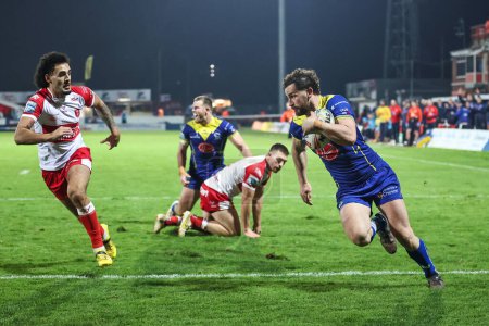 Photo for Toby King of Warrington Wolves goes over for a try during the Betfred Super League Round 4 match Hull KR vs Warrington Wolves at Sewell Group Craven Park, Kingston upon Hull, United Kingdom, 7th March 202 - Royalty Free Image