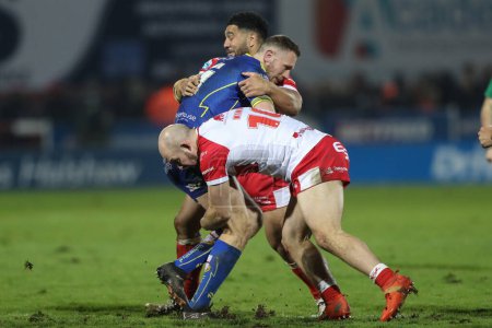Photo for George King of Hull KR tackles Matt Dufty of Warrington Wolves during the Betfred Super League Round 4 match Hull KR vs Warrington Wolves at Sewell Group Craven Park, Kingston upon Hull, United Kingdom, 7th March 202 - Royalty Free Image