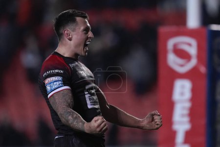 Photo for Deon Cross of Salford Red Devils celebrates victory after the Betfred Super League Round 4 match St Helens vs Salford Red Devils at Totally Wicked Stadium, St Helens, United Kingdom, 8th March 202 - Royalty Free Image