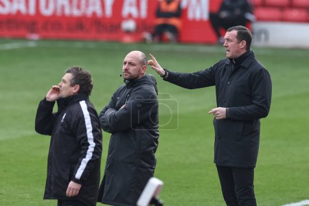 Photo for Neill Collins Head coach of Barnsley gives his team instructions during the Sky Bet League 1 match Barnsley vs Lincoln City at Oakwell, Barnsley, United Kingdom, 9th March 202 - Royalty Free Image
