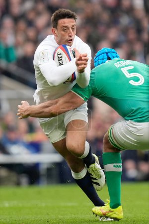 Photo for Alex Mitchell of England is tackled by Tadhg Beirne of Ireland during the 2024 Guinness 6 Nations match England vs Ireland at Twickenham Stadium, Twickenham, United Kingdom, 9th March 202 - Royalty Free Image