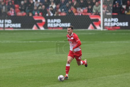 Photo for Josh Earl of Barnsley breaks with the ball during the Sky Bet League 1 match Barnsley vs Lincoln City at Oakwell, Barnsley, United Kingdom, 9th March 202 - Royalty Free Image