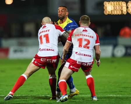 Photo for Paul Vaughan of Warrington Wolves is tackled by Dean Hadley of Hull KR during the Betfred Super League Round 4 match Hull KR vs Warrington Wolves at Sewell Group Craven Park, Kingston upon Hull, United Kingdom, 7th March 202 - Royalty Free Image