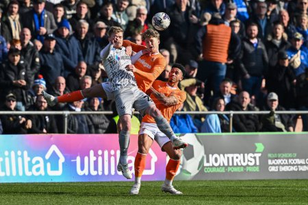Photo for George Byers of Blackpool battles for the high ball during the Sky Bet League 1 match Blackpool vs Portsmouth at Bloomfield Road, Blackpool, United Kingdom, 9th March 202 - Royalty Free Image