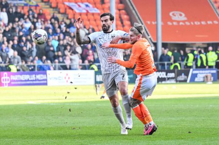 Photo for Hayden Coulson of Blackpool and Marlon Pack of Portsmouth battle for the ball during the Sky Bet League 1 match Blackpool vs Portsmouth at Bloomfield Road, Blackpool, United Kingdom, 9th March 202 - Royalty Free Image