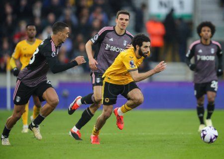 Photo for Rayan At-Nouri of Wolverhampton Wanderers breaks forward with the ball, during the Premier League match Wolverhampton Wanderers vs Fulham at Molineux, Wolverhampton, United Kingdom, 9th March 2024 - Royalty Free Image