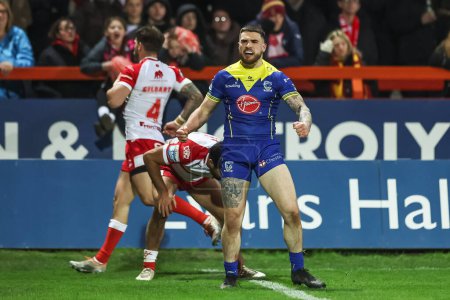 Photo for Connor Wrench of Warrington Wolves celebrates his try during the Betfred Super League Round 4 match Hull KR vs Warrington Wolves at Sewell Group Craven Park, Kingston upon Hull, United Kingdom, 7th March 202 - Royalty Free Image
