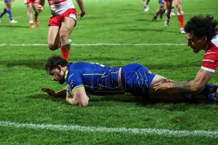 Photo for Toby King of Warrington Wolves goes over for a try during the Betfred Super League Round 4 match Hull KR vs Warrington Wolves at Sewell Group Craven Park, Kingston upon Hull, United Kingdom, 7th March 202 - Royalty Free Image