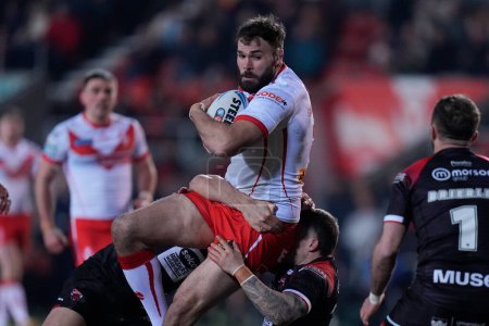 Photo for Alex Walmsley of St. Helens runs at the Salford Red Devils defence during the Betfred Super League Round 4 match St Helens vs Salford Red Devils at Totally Wicked Stadium, St Helens, United Kingdom, 8th March 202 - Royalty Free Image
