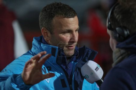 Photo for Willie Peters Head Coach of Hull KR speaks to BBC Radio 5 before the game during the Betfred Super League Round 4 match Hull KR vs Warrington Wolves at Sewell Group Craven Park, Kingston upon Hull, United Kingdom, 7th March 202 - Royalty Free Image