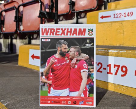 Photo for Ollie Palmer of Wrexham and Paul Mullin of Wrexham on the cover of the match day program in the stands of the SToK Cae Ras ahead of the match, during the Sky Bet League 2 match Wrexham vs Harrogate Town at SToK Cae Ras, Wrexham, United Kingdom, 12th - Royalty Free Image