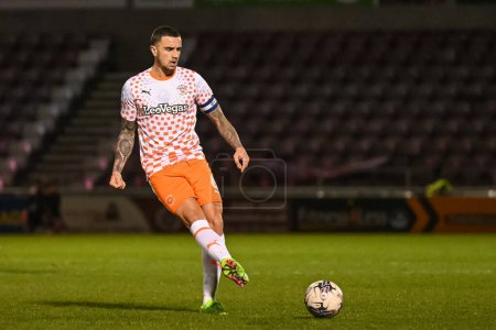 Photo for Oliver Norburn of Blackpool passes the ball during the Sky Bet League 1 match Northampton Town vs Blackpool at Sixfields Stadium, Northampton, United Kingdom, 12th March 202 - Royalty Free Image