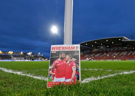 Photo for Ollie Palmer of Wrexham and Paul Mullin of Wrexham on the cover of the match day program pitch side ahead of the match, during the Sky Bet League 2 match Wrexham vs Harrogate Town at SToK Cae Ras, Wrexham, United Kingdom, 12th March 202 - Royalty Free Image