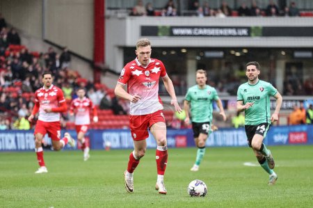 Photo for Sam Cosgrove of Barnsley breaks with the ball during the Sky Bet League 1 match Barnsley vs Cheltenham Town at Oakwell, Barnsley, United Kingdom, 16th March 202 - Royalty Free Image