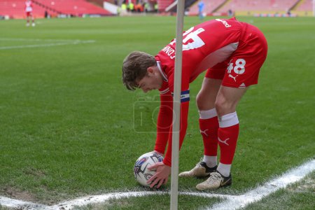 Photo for Luca Connell of Barnsley prepares to take a corner during the Sky Bet League 1 match Barnsley vs Cheltenham Town at Oakwell, Barnsley, United Kingdom, 16th March 202 - Royalty Free Image