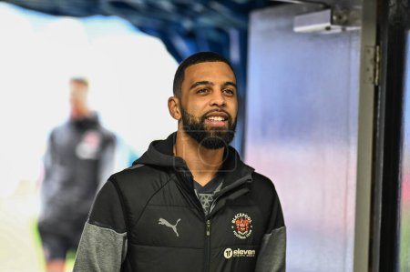 Photo for CJ Hamilton of Blackpool arrives ahead of the Sky Bet League 1 match Wigan Athletic vs Blackpool at DW Stadium, Wigan, United Kingdom, 16th March 202 - Royalty Free Image