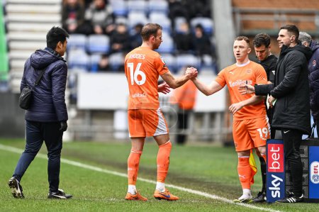 Photo for Jordan Rhodes of Blackpool leaves the field due to injury and is replaced by Shayne Lavery of Blackpool during the Sky Bet League 1 match Wigan Athletic vs Blackpool at DW Stadium, Wigan, United Kingdom, 16th March 202 - Royalty Free Image