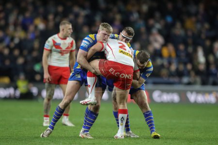 Photo for Konrad Hurrell of St. Helens is tackled during the Betfred Super League Round 5 match Leeds Rhinos vs St Helens at Headingley Stadium, Leeds, United Kingdom, 15th March 202 - Royalty Free Image