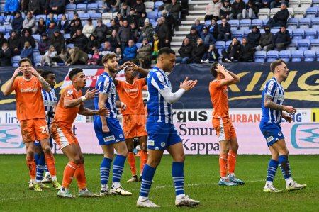 Photo for Kyle Joseph of Blackpool reacts to a missed chance on goal  during the Sky Bet League 1 match Wigan Athletic vs Blackpool at DW Stadium, Wigan, United Kingdom, 16th March 202 - Royalty Free Image