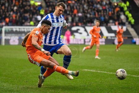Photo for Jordan Lawrence-Gabriel of Blackpool crosses the ball during the Sky Bet League 1 match Wigan Athletic vs Blackpool at DW Stadium, Wigan, United Kingdom, 16th March 202 - Royalty Free Image