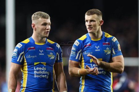 Photo for Harry Newman of Leeds Rhinos and Ash Handley of Leeds Rhinos applaud the fans at the end of the Betfred Super League Round 5 match Leeds Rhinos vs St Helens at Headingley Stadium, Leeds, United Kingdom, 15th March 202 - Royalty Free Image