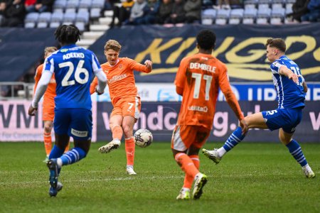 Photo for George Byers of Blackpool shoots on goal during the Sky Bet League 1 match Wigan Athletic vs Blackpool at DW Stadium, Wigan, United Kingdom, 16th March 202 - Royalty Free Image