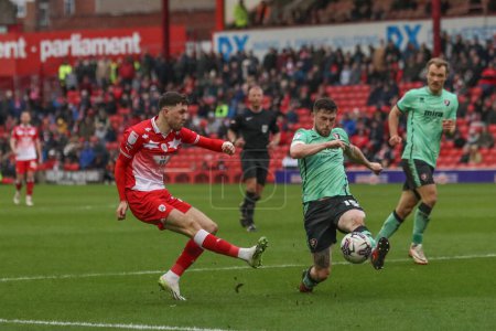 Photo for Corey O'Keeffe of Barnsley takes a shot on goal during the Sky Bet League 1 match Barnsley vs Cheltenham Town at Oakwell, Barnsley, United Kingdom, 16th March 202 - Royalty Free Image