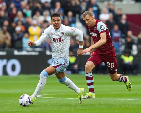 Photo for Morgan Rogers of Aston Villa makes a break with the ball during the Premier League match West Ham United vs Aston Villa at London Stadium, London, United Kingdom, 17th March 202 - Royalty Free Image
