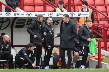 Photo for Neill Collins Head coach of Barnsley speaks to Martin Devaney first team coach of Barnsley  during the Sky Bet League 1 match Barnsley vs Cheltenham Town at Oakwell, Barnsley, United Kingdom, 16th March 202 - Royalty Free Image
