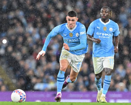 Photo for Phil Foden of Manchester City chases down the ball, during the Emirates FA Cup Quarter- Final match Manchester City vs Newcastle United at Etihad Stadium, Manchester, United Kingdom, 16th March 202 - Royalty Free Image