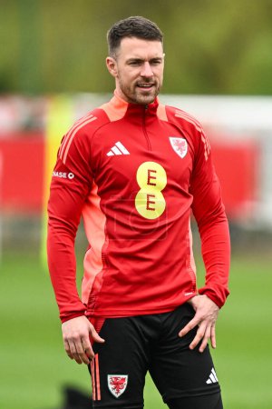 Photo for Aaron Ramsey of Wales during warms up ahead of the Wales open training session at Vale Resort Training complex, Hensol, United Kingdom, 20th March 202 - Royalty Free Image