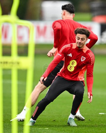 Photo for Ethan Ampadu of Wales during warms up ahead of the Wales open training session at Vale Resort Training complex, Hensol, United Kingdom, 20th March 202 - Royalty Free Image
