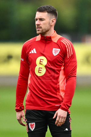 Photo for Aaron Ramsey of Wales during warms up ahead of the Wales open training session at Vale Resort Training complex, Hensol, United Kingdom, 20th March 202 - Royalty Free Image