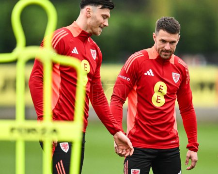 Photo for Aaron Ramsey of Wales during warms up ahead of the Wales open training session at Vale Resort Training complex, Hensol, United Kingdom, 20th March 2024 - Royalty Free Image
