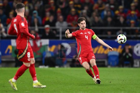 Photo for Ben Davies of Wales passes the ball, during the UEFA Euro Qualifiers Play-Off Semi-Final match Wales vs Finland at Cardiff City Stadium, Cardiff, United Kingdom, 21st March 202 - Royalty Free Image