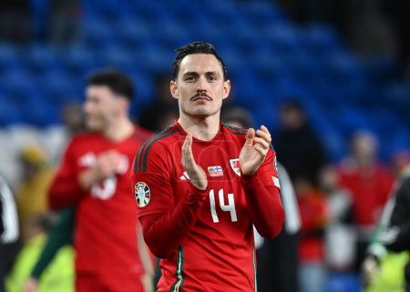 Photo for Connor Roberts of Wales claps fans at full time, during the UEFA Euro Qualifiers Play-Off Semi-Final match Wales vs Finland at Cardiff City Stadium, Cardiff, United Kingdom, 21st March 202 - Royalty Free Image