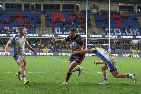 Photo for Alex Walmsley of St. Helens powers through to score a try during the Betfred Challenge Cup Sixth Round match Leeds Rhinos vs St Helens at Headingley Stadium, Leeds, United Kingdom, 22nd March 202 - Royalty Free Image