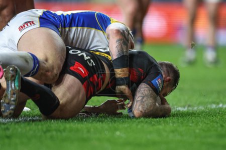 Photo for Daryl Clark of St. Helens goes over for a try during the Betfred Challenge Cup Sixth Round match Leeds Rhinos vs St Helens at Headingley Stadium, Leeds, United Kingdom, 22nd March 202 - Royalty Free Image