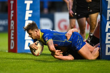 Photo for Jordan Crowther of Warrington Wolves goes over for a try during the Betfred Challenge Cup Sixth Round match Warrington Wolves vs London Broncos at Halliwell Jones Stadium, Warrington, United Kingdom, 23rd March 202 - Royalty Free Image