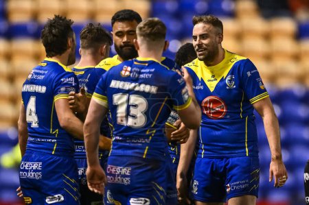 Photo for James Harrison of Warrington Wolves celebrates with team mates at the end of the Betfred Challenge Cup Sixth Round match Warrington Wolves vs London Broncos at Halliwell Jones Stadium, Warrington, United Kingdom, 23rd March 202 - Royalty Free Image