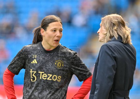 Photo for Former Manchester City footballer Ellen White speaks with Rachel Williams of Manchester United Women, during the The FA Women's Super League match Manchester City Women vs Manchester United Women at Etihad Stadium, Manchester, United Kingdom, 23rd Ma - Royalty Free Image