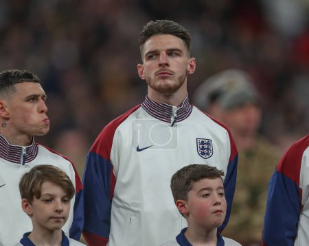 Photo for Declan Rice of England during the national anthem ahead of the International Friendly match England vs Brazil at Wembley Stadium, London, United Kingdom, 23rd March 202 - Royalty Free Image