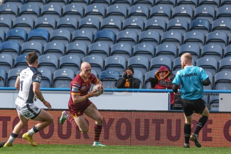 Photo for Adam Swift of Huddersfield Giants goes over for a try to make it 22-6 during the Betfred Challenge Cup Sixth Round match Huddersfield Giants vs Hull FC at John Smith's Stadium, Huddersfield, United Kingdom, 23rd March 202 - Royalty Free Image