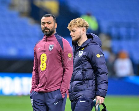 Photo for Ashley Cole Assistant Manager of England inspects the pitch ahead of the match with Harvey Elliott of England ahead of the UEFA Euro U21 Qualifiers Group F match England U21 vs Luxembourg U21 at Toughsheet Community Stadium, Bolton, United Kingdom, 2 - Royalty Free Image