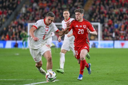 Photo for Bartosz Slisz of Poland and Daniel James of Wales battle for the ball during the UEFA Euro Qualifiers Eliminator Group A match Wales vs Poland at Cardiff City Stadium, Cardiff, United Kingdom, 26th March 202 - Royalty Free Image