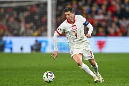 Photo for Robert Lewandowski of Poland breaks with the ball during the UEFA Euro Qualifiers Eliminator Group A match Wales vs Poland at Cardiff City Stadium, Cardiff, United Kingdom, 26th March 202 - Royalty Free Image