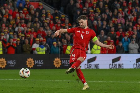 Photo for Ben Davies of Wales scores his penalty during the UEFA Euro Qualifiers Eliminator Group A match Wales vs Poland at Cardiff City Stadium, Cardiff, United Kingdom, 26th March 202 - Royalty Free Image