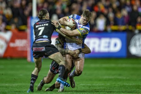 Photo for James McDonnell of Leeds Rhinos is tackled by Jacob Miller of Castleford Tigers during the Betfred Super League Round 6 match Castleford Tigers vs Leeds Rhinos at The Mend-A-Hose Jungle, Castleford, United Kingdom, 28th March 202 - Royalty Free Image