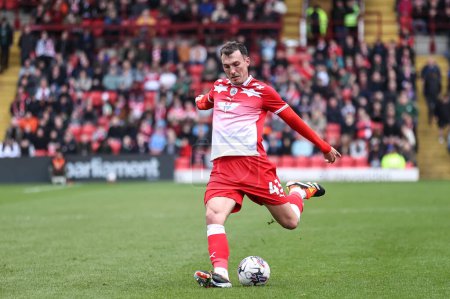 Photo for Josh Earl of Barnsley crosses the ball during the Sky Bet League 1 match Barnsley vs Cambridge United at Oakwell, Barnsley, United Kingdom, 29th March 202 - Royalty Free Image
